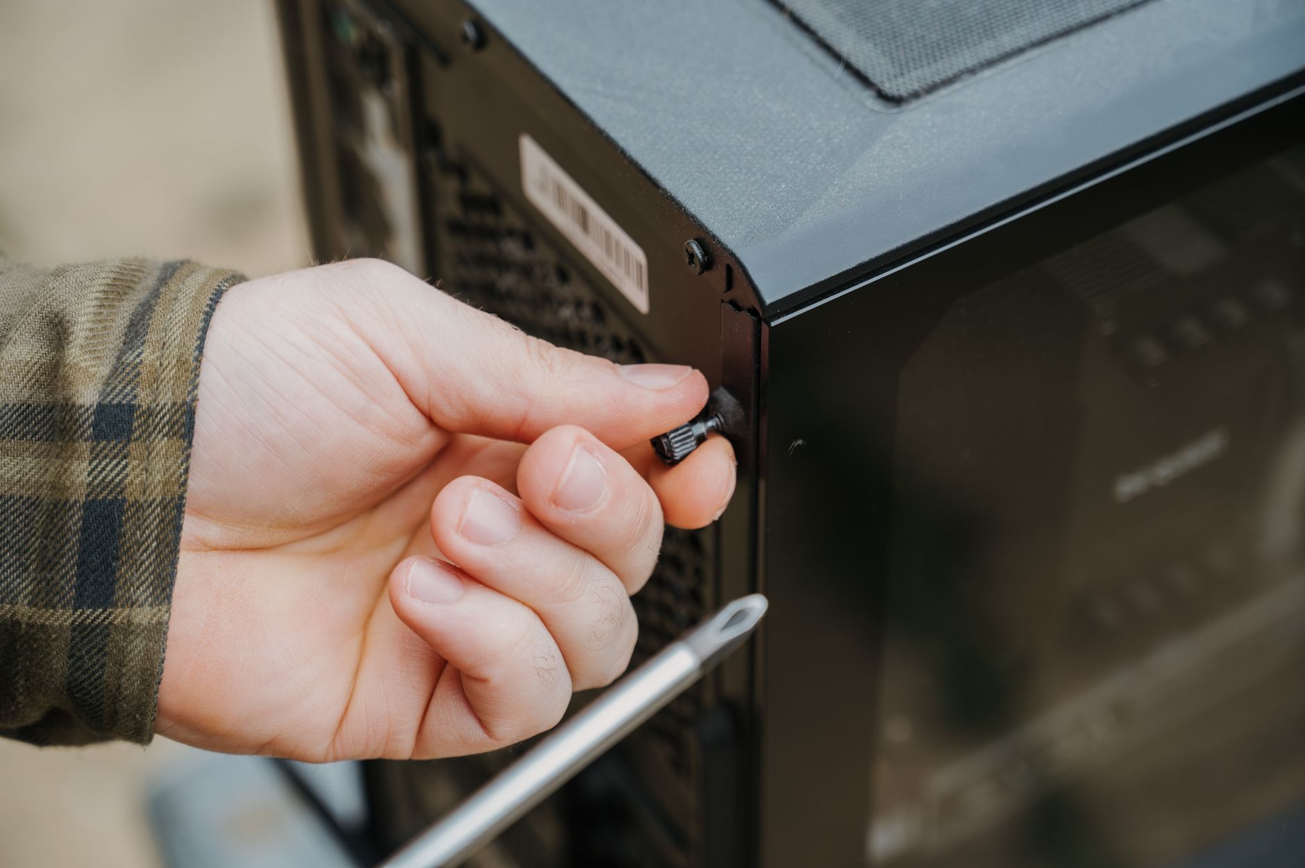 person performing computer maintenance on desktop pc