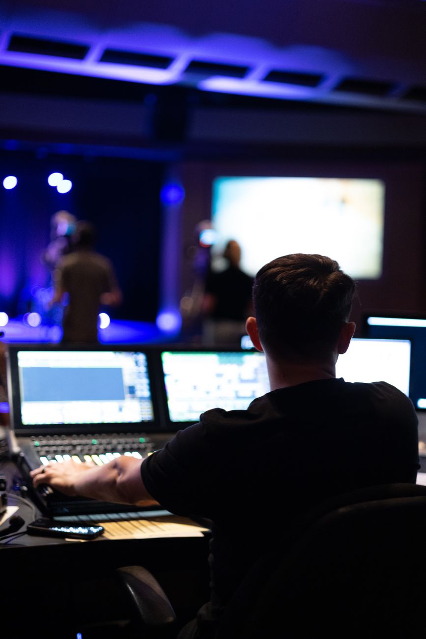sound engineer mixing live performance in studio